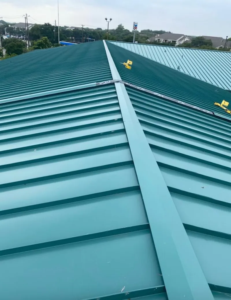 Green commercial metal roof ridge and valley for Metal Roof Repair in Osage Beach