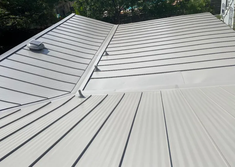 Solar attic fan installed on a metal roof for Roof Ventilation in Osage Beach